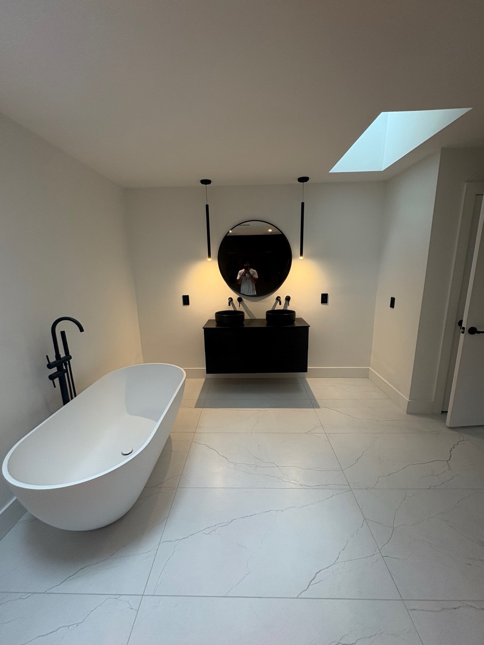 Bathroom renovation with modern fixtures and improved layout